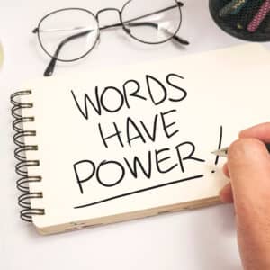 "Words have power" written on a notepad